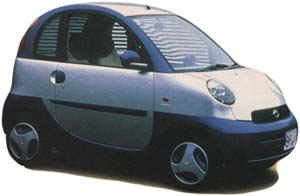 TOYOTA E-COM Making a Volkswagen Bug look like a behemoth, Toyota's experimental E-Com is a two-seat electric vehicle designed for use on college campuses and in planned residential developments. Though perfectly street legal, its 60 mile range (short even by liberal industry standards) relegates the E-Com to jaunts to the store and back.
